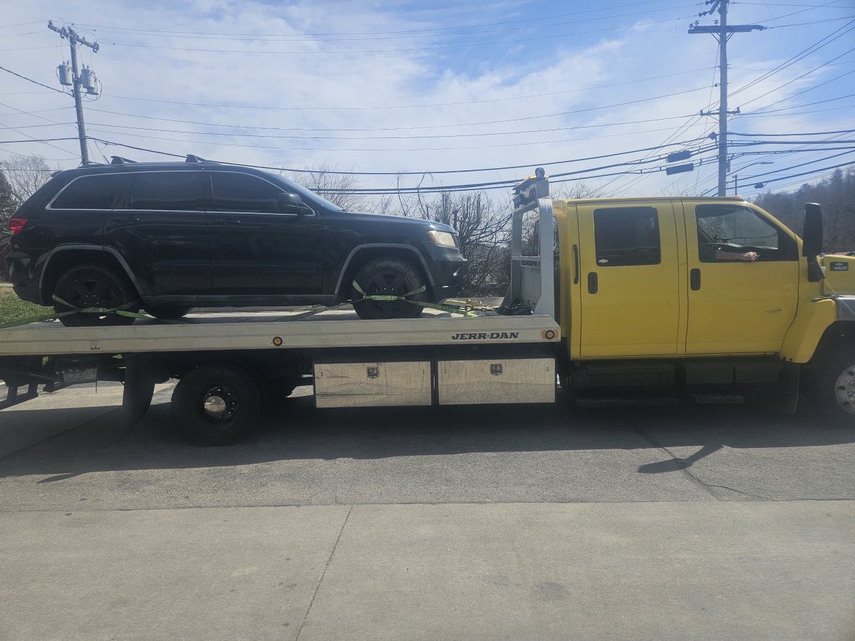 Automotive Reset Technician LLC. flatbed tow truck